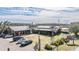 Starkey Market with multiple buildings, ample parking, and rustic windmill detail at 3450 Ferrell St, New Port Richey, FL 34655