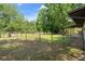 The yard is partially fenced with mature trees providing lots of shade at 34577 Orchid Pkwy, Dade City, FL 33523