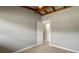 The bedroom features light grey walls, updated flooring, and an open closet area at 34577 Orchid Pkwy, Dade City, FL 33523