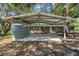 Carport in front of the house with steel support beams, storage, and covered parking at 34577 Orchid Pkwy, Dade City, FL 33523