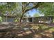 Charming single story home with brick and siding accents and shaded front yard at 34577 Orchid Pkwy, Dade City, FL 33523