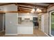 Updated kitchen with white cabinets, stainless steel appliances, breakfast bar, and natural light at 34577 Orchid Pkwy, Dade City, FL 33523