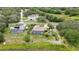 Overhead view of a beautiful residential home with a swimming pool in the backyard at 364 Waterfall Dr, Spring Hill, FL 34608
