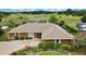 Aerial view showcases property with nearby bodies of water, lush green spaces and surrounding mature trees at 364 Waterfall Dr, Spring Hill, FL 34608