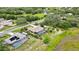 Aerial view of a beautiful single Gathering home with a screened-in pool and large yard at 364 Waterfall Dr, Spring Hill, FL 34608
