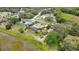 Aerial view of a beautiful single Gathering home with a screened-in pool and large yard at 364 Waterfall Dr, Spring Hill, FL 34608