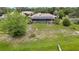 Back view of a beautiful single Gathering home with a screened-in pool and large yard at 364 Waterfall Dr, Spring Hill, FL 34608