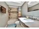Updated bathroom with tiled shower/tub and granite vanity at 364 Waterfall Dr, Spring Hill, FL 34608