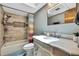 Updated bathroom with tiled shower/tub and granite vanity at 364 Waterfall Dr, Spring Hill, FL 34608