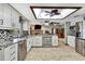 Modern kitchen showcasing stainless steel appliances, tiled backsplash, and an open design at 364 Waterfall Dr, Spring Hill, FL 34608