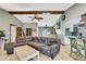 Inviting living area with tiled floors, cozy seating, and a view into the kitchen area at 364 Waterfall Dr, Spring Hill, FL 34608