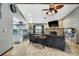 Spacious living room featuring tiled floors, stone fireplace, and an open floor plan at 364 Waterfall Dr, Spring Hill, FL 34608