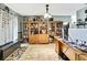 Spacious office featuring a large wooden bookcase and tile flooring at 364 Waterfall Dr, Spring Hill, FL 34608