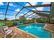 Inviting screened pool area with comfortable lounge chairs and scenic view at 364 Waterfall Dr, Spring Hill, FL 34608