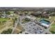 Community clubhouse featuring a pool, tennis courts, and ample parking, ideal for an active lifestyle at 3712 Trophy Blvd # 3712, New Port Richey, FL 34655
