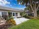 Cozy back patio with mature landscaping and inviting outdoor space at 3712 Trophy Blvd # 3712, New Port Richey, FL 34655