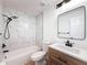 Modern bathroom featuring sleek black fixtures, white tile, and a stylish vanity at 3712 Trophy Blvd # 3712, New Port Richey, FL 34655