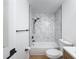 Modern bathroom featuring sleek black fixtures, white tile, and a stylish vanity at 3712 Trophy Blvd # 3712, New Port Richey, FL 34655