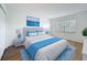 Bedroom with a made bed, two side tables, and a window at 3712 Trophy Blvd # 3712, New Port Richey, FL 34655
