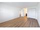 Bedroom featuring wood-look floors, two closets and a bathroom at 3712 Trophy Blvd # 3712, New Port Richey, FL 34655