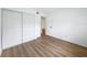 Bedroom featuring light wood floors and closet for maximum storage at 3712 Trophy Blvd # 3712, New Port Richey, FL 34655
