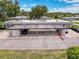 View of the carports attached to the condos, and community lawn at 3712 Trophy Blvd # 3712, New Port Richey, FL 34655