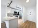 Modern kitchen features stainless steel appliances, white cabinets, and sleek countertops at 3712 Trophy Blvd # 3712, New Port Richey, FL 34655