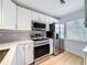 Beautiful kitchen showcasing stainless steel appliances and plenty of counter space at 3712 Trophy Blvd # 3712, New Port Richey, FL 34655