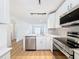 Bright kitchen showcasing stainless steel appliances, white cabinets, and sleek countertops at 3712 Trophy Blvd # 3712, New Port Richey, FL 34655