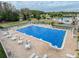 Resort-style pool with ample seating, perfect for enjoying sunny days in a relaxing community setting at 3712 Trophy Blvd # 3712, New Port Richey, FL 34655