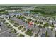 Aerial view of a residential neighborhood showcasing homes, lakes, and a serene environment at 3885 Villamore Ln, Odessa, FL 33556