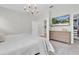 Clean, airy bedroom with ample storage, television, and neutral color palette at 3885 Villamore Ln, Odessa, FL 33556
