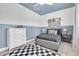 Charming bedroom with blue walls, modern decor, and comfortable bed at 3885 Villamore Ln, Odessa, FL 33556