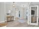 Welcoming foyer with wood-look floors, decorative lighting, and an open layout with modern design at 3885 Villamore Ln, Odessa, FL 33556