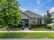 Charming single-story home with manicured landscaping and a welcoming front entrance, embodying suburban curb appeal at 3885 Villamore Ln, Odessa, FL 33556