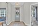 Bright entryway showcasing a decorative glass door and stylish foyer with neutral walls and modern lighting at 3885 Villamore Ln, Odessa, FL 33556