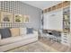Charming home office with a cozy sofa and built-in desk, perfect for working from home or studying at 3885 Villamore Ln, Odessa, FL 33556