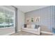 Bright home office with a comfortable sofa, perfect for working or reading at 3885 Villamore Ln, Odessa, FL 33556