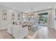 Bright and airy living room featuring a comfortable sectional sofa, neutral tones, and access to an outdoor patio at 3885 Villamore Ln, Odessa, FL 33556