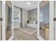 Cozy office space with glass French doors, couch, and accent wall at 3885 Villamore Ln, Odessa, FL 33556