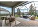 Enjoy outdoor living on this spacious screened patio with comfortable seating and dining areas at 3885 Villamore Ln, Odessa, FL 33556