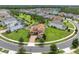 Stunning aerial view of a home on a cul-de-sac, showcasing lush landscaping and proximity to neighborhood amenities at 4026 Bonfire Dr, Odessa, FL 33556