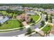 Stunning aerial view of the home surrounded by lush landscaping in a desirable neighborhood location at 4026 Bonfire Dr, Odessa, FL 33556