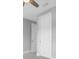 Neutral-toned bedroom with closed door and white trim at 4026 Bonfire Dr, Odessa, FL 33556
