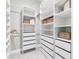 Spacious walk-in closet with custom shelving and drawers for organization at 4026 Bonfire Dr, Odessa, FL 33556