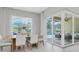 Bright dining area with view to lanai, neutral tones and plenty of space at 4026 Bonfire Dr, Odessa, FL 33556