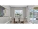 Dining room with neutral tones, a view of the pool, and abundant natural light at 4026 Bonfire Dr, Odessa, FL 33556