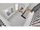 Bright foyer and stairway with iron railings, glass paneled doors, and natural light at 4026 Bonfire Dr, Odessa, FL 33556