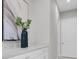 Hallway featuring a decorative vase and artwork at 4026 Bonfire Dr, Odessa, FL 33556