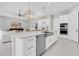 A large kitchen island with stainless steel appliances and gold hardware at 4026 Bonfire Dr, Odessa, FL 33556